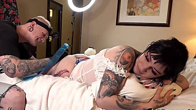 Busty brunette Misha Montana gets a new leg tattoo