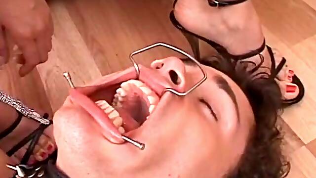 Fetish babe pose smocking while slave licks her high heels
